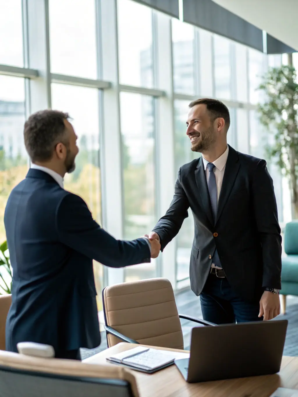 An image of a handshake over a financial document, representing trust and partnership in the asset recovery process.
